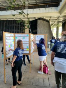 People write and attach responses to "You May Think I Am" cards on a display at the 2022 People Not Prisons lobby day State Capital in Honolulu organized by ACLU Hawai'i.